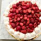 Vanilla cake with layers of Chiboust pastry cream, macerated strawberries, and crushed and whole strawberry-scented meringue.