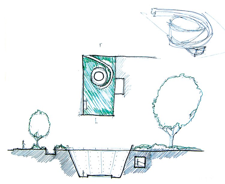 Shor’s structure is entirely below surface level, with simple greenery adorning the street level of the park surrounding the opening of the Spiritual Spring.