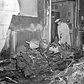One of the bomber's motors, trailing part of the plane, crashed through two walls of the building, plummeted through roof and ended up burning in studio at 10 W. 33d St.