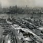A view of Long Island City in 1940, with the tunnel in the middle of the image, and the Manhattan skyline in the background.