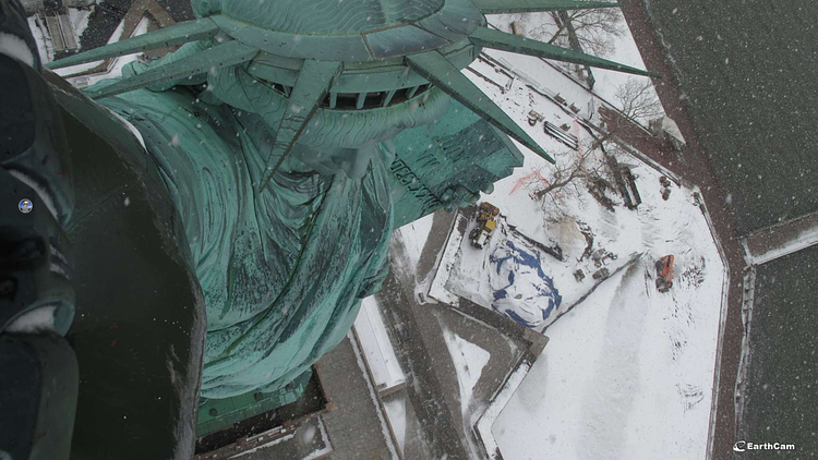 Looking Down on the Statue of Liberty as She Enjoys the Snow Day