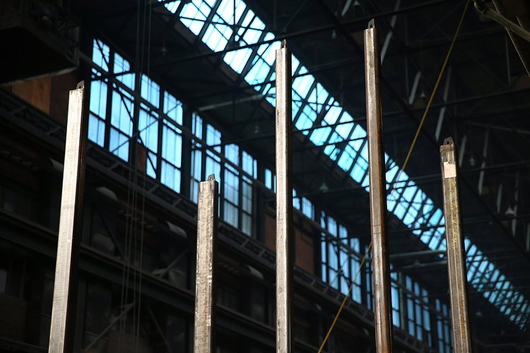 Structural steel rises from the chassis of a module that will include the a section of the building’s stairwell and elevator.