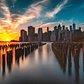 Sunset over Lower Manhattan skyline from Brooklyn Bridge Park