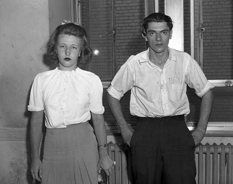 Mob Moll, 1944: She stands by her man! 19-year-old Virgina Ornmark looks unfazed as she and beau Fred Schmidt, 24, stare blankly at the camera after being arraigned for the murder of a lingerie merchant in 1944.