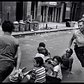 A police woman plays duck duck goose with children in Harlem, NYC, New York, US in 1978.