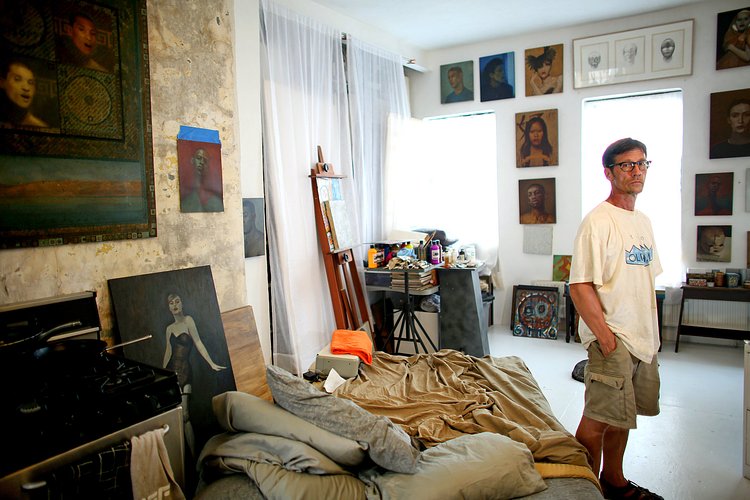 Steven Ashmore, inside his apartment in Umbrella House, was one of a handful of squatters who used a sledgehammer to break into the building in 1988.