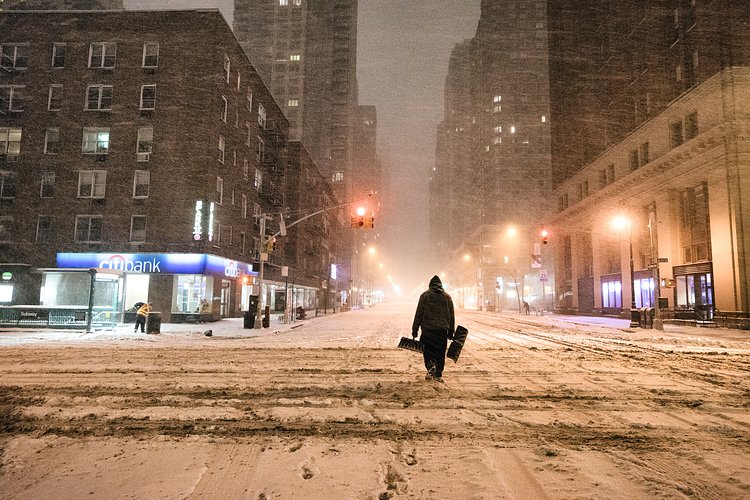 New York City - Snow - Winter Storm Juno - Empty 6th Avenue | Juno: The first snowstorm of 2015 in New York City.

---

(Note: My <a href="http://www.amazon.com/gp/product/1440339589/ref=as_li_tl?ie=UTF8&amp;camp=1789&amp;creative=9325&amp;creativeASIN=1440339589&amp;linkCode=as2&amp;tag=nyththle0e-20&amp;linkId=ER6GYT5FRYNMEPLF" rel="nofollow">New York photography book</a> released worldwide in stores/online recently and has photos similar to this  [full info below])

---

I have been photographing New York City during snowstorms at night for the past 5 years. When it comes to experiencing <a href="http://nythroughthelens.com/tagged/snow" rel="nofollow">New York City in the snow</a>, I relish the challenge. The more gusty, snowy, and brutal the storm, the more of a chance that I will be out in it traipsing around New York City with my cameras in tow.

When I heard that the MTA was suspending all transit service (and most vehicles) at 11 pm, I made the decision to take the train up to the Upper East Side prior to 11 pm to deposit myself up there with the intention of walking from the Upper East Side to Times Square and then walking the several miles back to the Lower East Side (whew!!).

The streets were eerily empty.

Emptier than they are usually at night during snowfall. Since there was a ban on all vehicles aside from snow plows and emergency services, there were practically no cars at all on the streets. Even taxis were banned from the streets!

I walked in the middle of avenues and streets that are usually teeming with cars.

There was an eerie sense of calm.

It was magical.


---

This is part of a post that I posted to my NYC photography blog. If you are curious enough to look at the photos there, here is the link to the post:

<a href="http://nythroughthelens.com/post/109291619025/new-york-city-snow-winter-storm-juno-i" rel="nofollow">New York City - Winter Storm Juno</a>


----

* As mentioned above - My New York City coffee table book that released in stores/online worldwide recently.

 Tons of information about my <a href="http://www.amazon.com/gp/product/1440339589/ref=as_li_tl?ie=UTF8&amp;camp=1789&amp;creative=9325&amp;creativeASIN=1440339589&amp;linkCode=as2&amp;tag=nyththle0e-20&amp;linkId=ER6GYT5FRYNMEPLF" rel="nofollow">New York photography book</a> with sample pages (including where to order and what stores are carrying it) here:

<a href="http://nythroughthelens.com/post/92873566010/ny-through-the-lens-the-book-i-am-super" rel="nofollow">NY Through The Lens: A New York Coffee Table Book</a>
---


View my New York City photography at my website <a href="http://nythroughthelens.com/" rel="nofollow">NY Through The Lens</a>.

View my Travel photography at my travel blog: <a href="http://travelinglens.me/" rel="nofollow">Traveling Lens</a>.

Interested in my work and have questions about PR and media? Check out my:

<a href="http://nythroughthelens.com/about" rel="nofollow">About Page</a> | <a href="http://nythroughthelens.com/PR" rel="nofollow">PR Page</a> | <a href="http://nythroughthelens.com/media" rel="nofollow">Media Page</a>