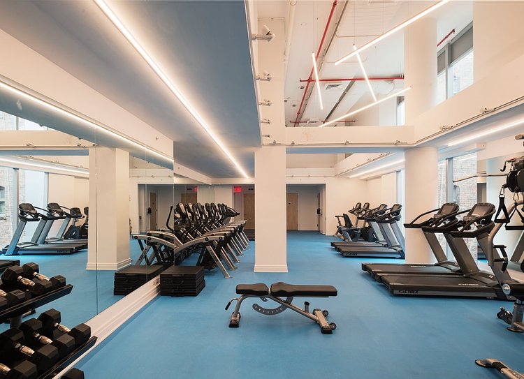 The building also counts a gym among its amenities. Use of both the gym and rooftop will cost residents about $600 a year.