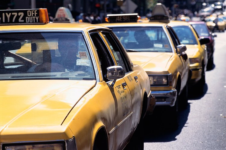 Taxis move through a traffic lane in New York City, 1995