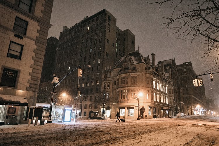 New York City - Snow - Winter Storm Juno - Upper East Side | Juno: The first snowstorm of 2015 in New York City.

---

(Note: My <a href="http://www.amazon.com/gp/product/1440339589/ref=as_li_tl?ie=UTF8&amp;camp=1789&amp;creative=9325&amp;creativeASIN=1440339589&amp;linkCode=as2&amp;tag=nyththle0e-20&amp;linkId=ER6GYT5FRYNMEPLF" rel="nofollow">New York photography book</a> released worldwide in stores/online recently and has photos similar to this  [full info below])

---

I have been photographing New York City during snowstorms at night for the past 5 years. When it comes to experiencing <a href="http://nythroughthelens.com/tagged/snow" rel="nofollow">New York City in the snow</a>, I relish the challenge. The more gusty, snowy, and brutal the storm, the more of a chance that I will be out in it traipsing around New York City with my cameras in tow.

When I heard that the MTA was suspending all transit service (and most vehicles) at 11 pm, I made the decision to take the train up to the Upper East Side prior to 11 pm to deposit myself up there with the intention of walking from the Upper East Side to Times Square and then walking the several miles back to the Lower East Side (whew!!).

The streets were eerily empty.

Emptier than they are usually at night during snowfall. Since there was a ban on all vehicles aside from snow plows and emergency services, there were practically no cars at all on the streets. Even taxis were banned from the streets!

I walked in the middle of avenues and streets that are usually teeming with cars.

There was an eerie sense of calm.

It was magical.


---

This is part of a post that I posted to my NYC photography blog. If you are curious enough to look at the photos there, here is the link to the post:

<a href="http://nythroughthelens.com/post/109291619025/new-york-city-snow-winter-storm-juno-i" rel="nofollow">New York City - Winter Storm Juno</a>


----

* As mentioned above - My New York City coffee table book that released in stores/online worldwide recently.

 Tons of information about my <a href="http://www.amazon.com/gp/product/1440339589/ref=as_li_tl?ie=UTF8&amp;camp=1789&amp;creative=9325&amp;creativeASIN=1440339589&amp;linkCode=as2&amp;tag=nyththle0e-20&amp;linkId=ER6GYT5FRYNMEPLF" rel="nofollow">New York photography book</a> with sample pages (including where to order and what stores are carrying it) here:

<a href="http://nythroughthelens.com/post/92873566010/ny-through-the-lens-the-book-i-am-super" rel="nofollow">NY Through The Lens: A New York Coffee Table Book</a>
---


View my New York City photography at my website <a href="http://nythroughthelens.com/" rel="nofollow">NY Through The Lens</a>.

View my Travel photography at my travel blog: <a href="http://travelinglens.me/" rel="nofollow">Traveling Lens</a>.

Interested in my work and have questions about PR and media? Check out my:

<a href="http://nythroughthelens.com/about" rel="nofollow">About Page</a> | <a href="http://nythroughthelens.com/PR" rel="nofollow">PR Page</a> | <a href="http://nythroughthelens.com/media" rel="nofollow">Media Page</a>