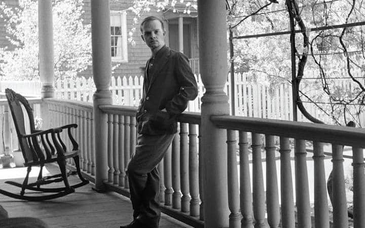 Truman Capote photographed on the porch of his Brooklyn Heights home, 1958
