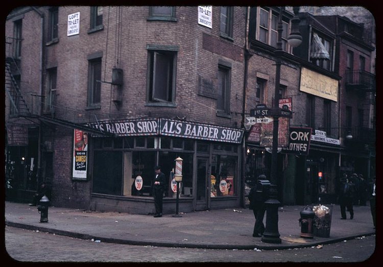Here's a view of the other side of the street, at the southeast corner of the intersection. The pictured barbershop is now a boutique clothing store.