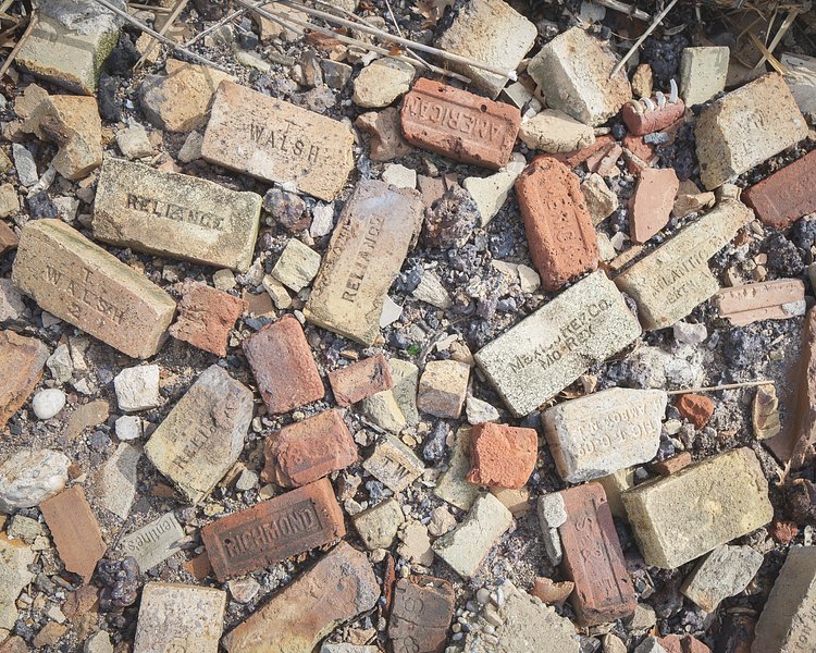 Manufacturer’s marks on the bricks point to a wide range of origins.