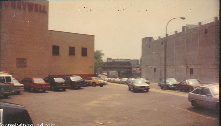 A short LIRR freight train crossing Hunterspoint Avenue on the Cutoff in 1988. Note that there’s a caboose right behind the locomotive – the LIRR regularly used them on freight trains right up until the early 1990s.