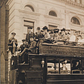 Group portrait of passengers on an observation automobile.