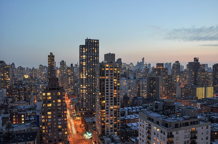 Manhattan skyline from the Upper East Side | Yorkville, New York City, NY // Manhattan skyline from a roof on the Upper East Side.  First Avenue is below and a sunset in the background.  // 3/10/2014