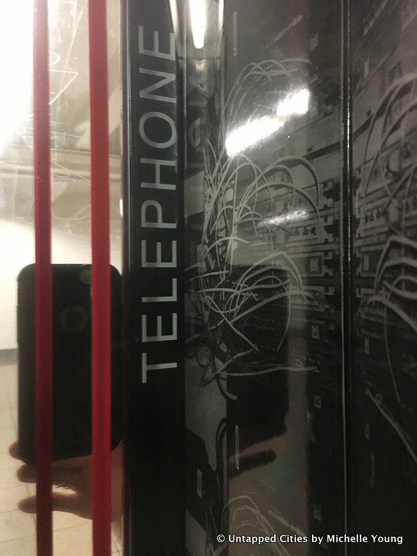 Along one corridor between the 14th Street and 17th Street entrances are narrow openings, with printed fragments of the station’s history, like telephone cables and names of former transit workers.