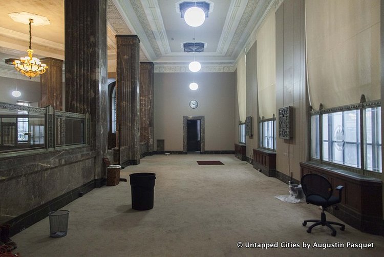 The banking hall is mostly empty, with items left over from fill shoots. On the other side of this space is the dry cleaning pickup area of 20 Exchange