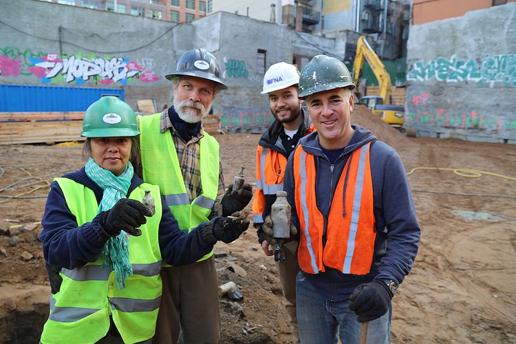 Scott Jordan, second from left, and Bob Perl, far right, at the dig site, with Jordan’s assistant, far left, and the construction-site foreman, second from right.