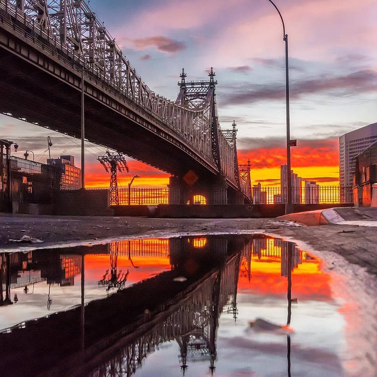 Sunrise over the Ed Koch Queensboro Bridge. Photographed from the Manhattan side on Dec 24, 2017. Manhattan, New York City