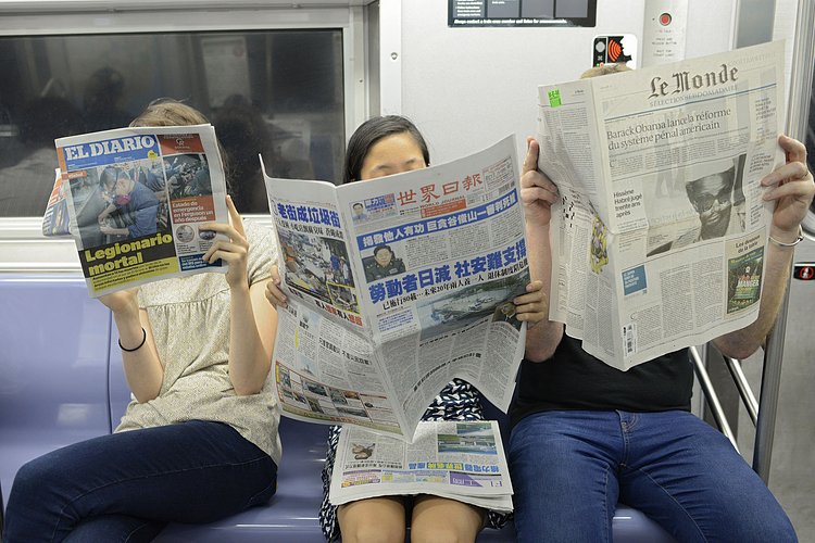 People on Subway Reading Spanish, Chinese and French Newspapers | You can use this photo for non-commercial purposes if you give credit, under this <a href="https://creativecommons.org/licenses/by-nc/3.0/us/" rel="nofollow">Creative Commons license</a>. For-profit media organizations also may use this, but as editorial content only (as illustrations for stories, for example, but not as advertising). Credit must read: Richard Yeh / WNYC

We'd love to know if you're using this photo - send us an email (jkeefe@wnyc.org)!