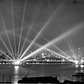 Battleships USS Texas and USS New York on the Hudson light up the night sky with their huge searchlights in search of imaginary aerial attackers. New York, 3 May 1939.