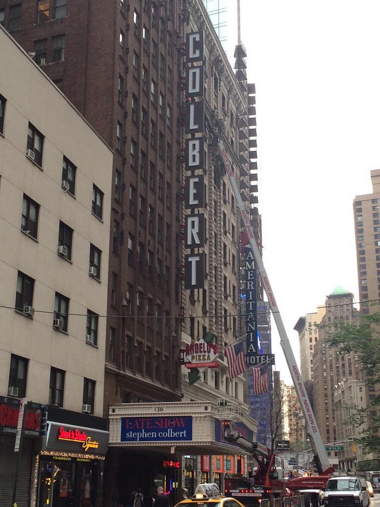 Sign guys at Ed Sullivan Theater currently affixing giant neon COLBERT letters to the building http://t.co/0MuOqn2rVl