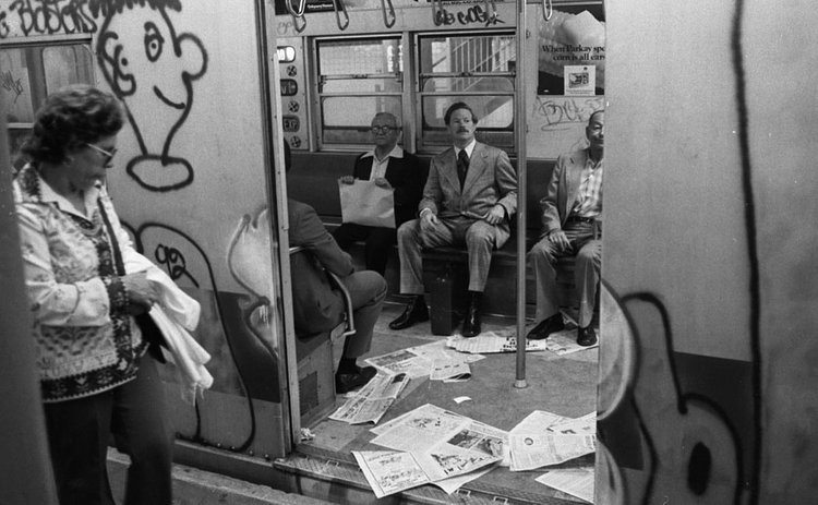 1970's: Despite the more than 40 percent increase in subway fare, this 1975 subway car is still covered in graffiti and littered with trash.
