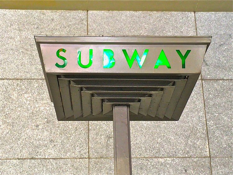 The coolest neon green subway sign in Brooklyn