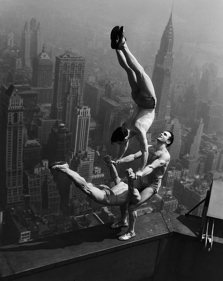 Acrobats performing at the opening of the Empire State Building, May 1st, 1931