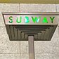 The coolest neon green subway sign in Brooklyn