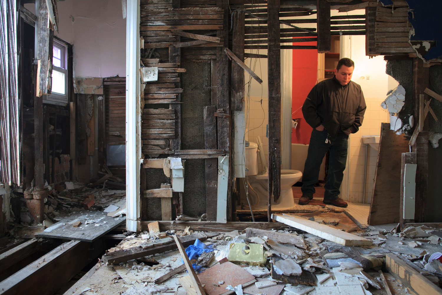 Rolando Cajina in his apartment at 98 Linden Street in Brooklyn, which prosecutors say the Israels intentionally wrecked.