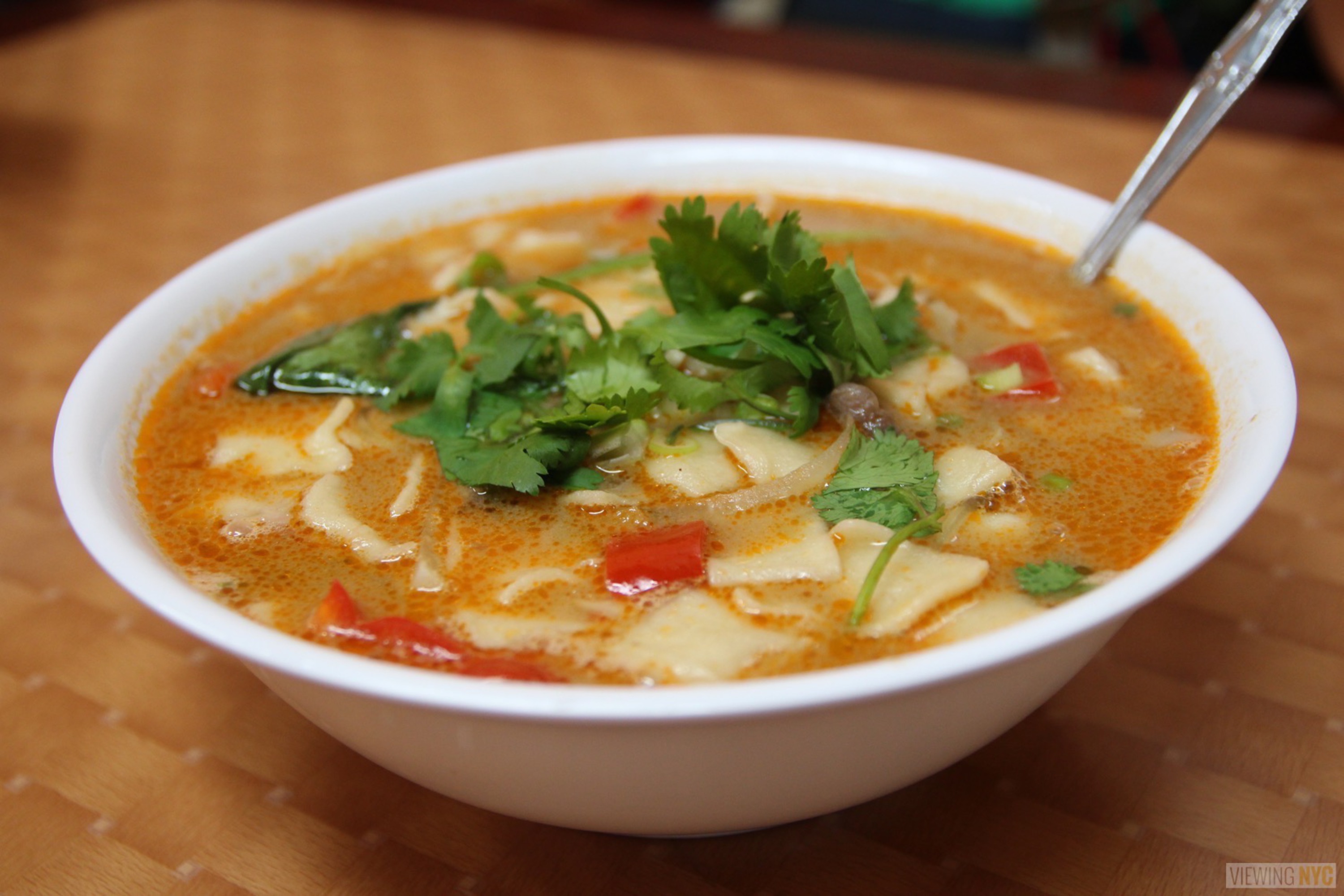 Bessie's Best Tasty Tibetan Treats Behind a Jackson Heights Cell Phone