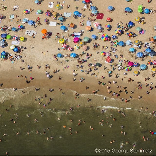 Photograph by George Steinmetz @geosteinmetz / @thephotosociety  Through the 1950s, a million people might squeeze onto New York City's Coney Island Beach on a hot summer day and newspapers would send photographers to Coney Island on the 4th of July to capture the festive scene—in some pictures, you can’t see the sand for the people. Today, relaxed sunbathers have more room to stretch out. #airconditioning
