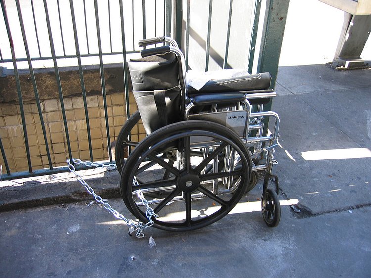 Wheelchair chained to NYC Subway stairs
