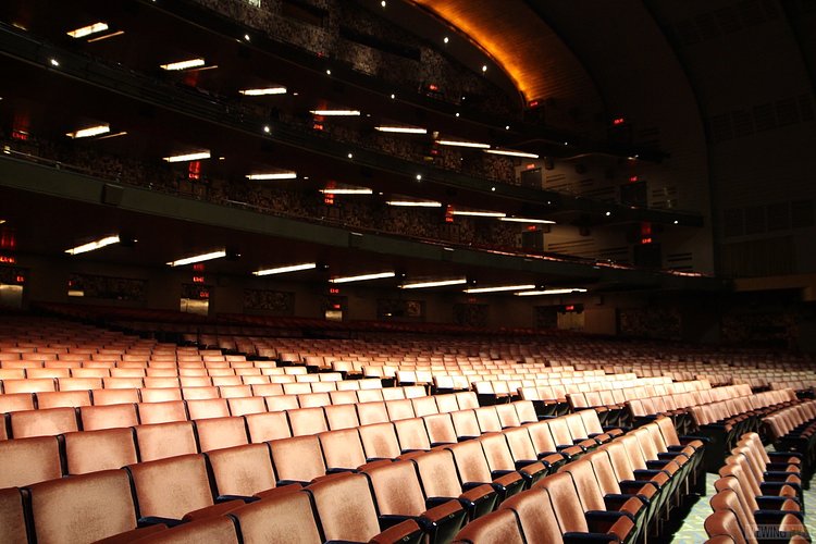 Orchestra Seating | Built in 1932, Radio City Music Hall is a prime example of art deco architectural style that has withstood the test of time. With tons of gold, reflective surfaces and geometric design, walking through the venue is a bit like stepping back in time. Most of the fixtures, furniture and ornamentation are original, and any replacements are exact replicas of how the theater looked 80 years ago.

Read more here: <a href="https://viewing.nyc/i-braved-a-walkthrough-of-radio-city-music-hall-meant-for-tourists/" rel="nofollow">viewing.nyc/i-braved-a-walkthrough-of-radio-city-music-ha...</a>
