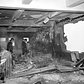 B-25 Mitchell bomber smashed beyond recognition into Empire State Building. This is a picture of the wreckage-strewn 79th floor where the bomber tore a 18-foot hole in wall. Propeller is embeded in the wall at the left.