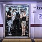 42 Street - Grand Central Station, 4, 5 or 6 Train, Uptown Platform 2014.07.26 | Most people don't see it at first, but the woman in the blue baseball cap (to the right) is actually looking directly into the camera.