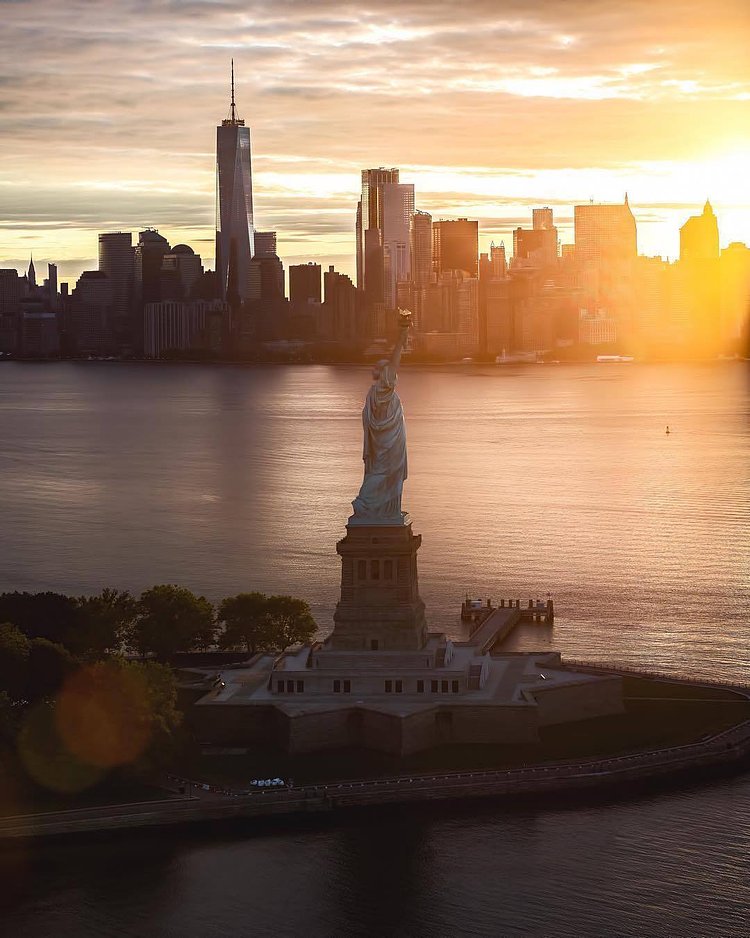New York, New York. Photo via @flynyon #viewingnyc #newyork #newyorkcity #nyc #sunrise #statueofliberty