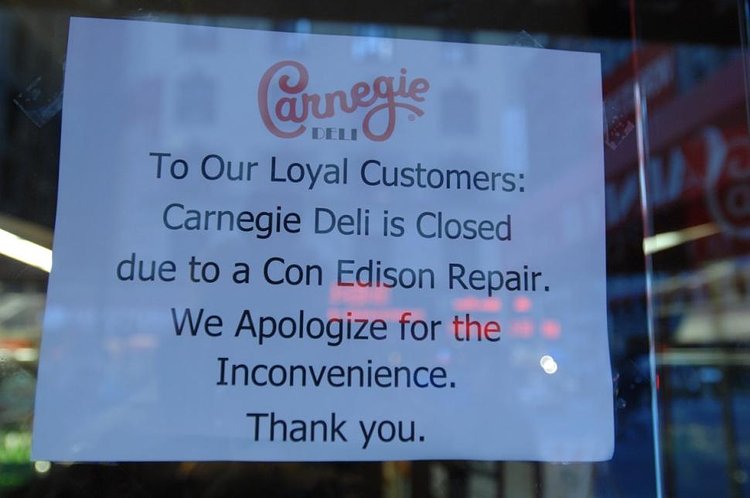 A sign on the window of Carnegie Deli on Seventh Ave. Friday announces that it's closed for a "Con Edison Repair."