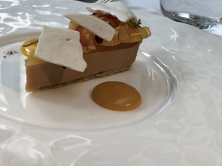 Foie gras tart glazed with sliced peaches and lemon thyme.