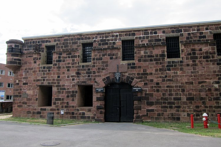 NYC - Governors Island: Castile Williams | Castle Williams, located on the northwest point of Governors Island, was designed and erected between 1807 and 1811 under the direction of Lieutenant Colonel (later Colonel) Jonathan Williams, Chief Engineer of the Corps of Engineers and first Superintendent of the United States Military Academy at West Point. The nearly circular fort, measuring 210 feet in diameter with 40-foot high and 7 to 8 feet thick red sandstone walls, established a prototype for American coastal fortification design for the rest of the 19th century with its multiple levels of enclosed or fortified gun enplacements (casemates)...During the Civil War, the casemates of Castle Williams alternatively housed newly recruited Union troops, served as a barracks for the garrison's troops, and imprisoned Confederate enlisted men and deserters from the Union Army.  Following the war, it became a low-security military prison until the Coast Guard arrived in 1966 and converted it into a community center.