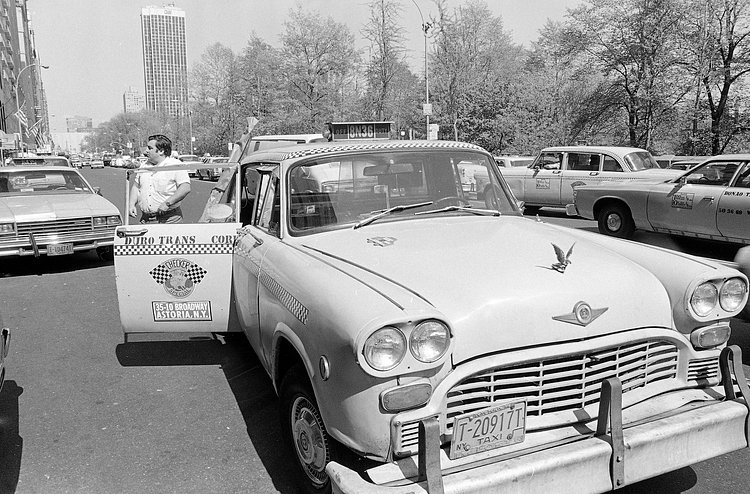 A checkered cab is pulled over on New York's Central Park South, May 4, 1982, right around the time that the Checkered Motor Co. announced it was going out of production.