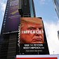 Giant billboard in Times Square calling from Donald Trump's resignation