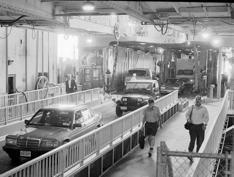Cars come off the ferry John F. Kennedy at Whitehall Terminal