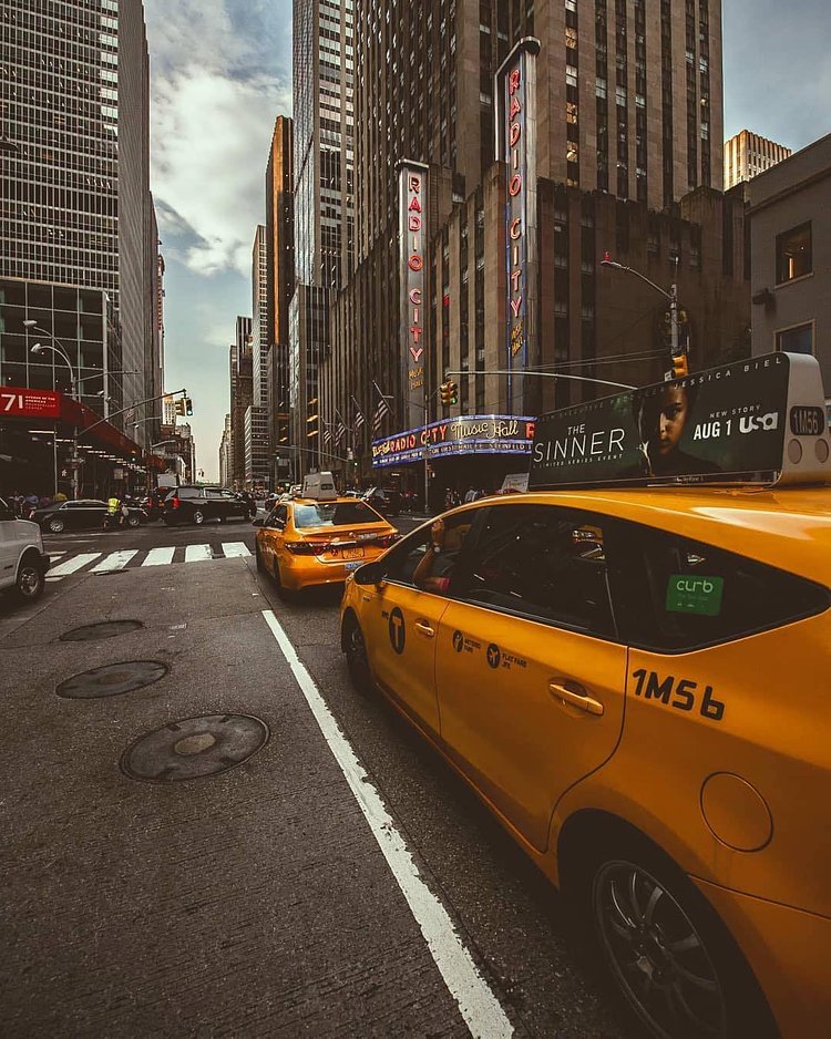 New York, New York. Photo via @m_bautista330 #viewingnyc #newyork #newyorkcity #nyc #taxis #6thavenue #radiocitymusichall