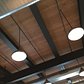 Industrial lights and wooden ceilings keep the vintage warehouse look and feel.