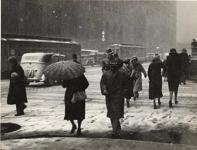 1935 snowstorm effects on midtown Manhattan. Life goes on.
