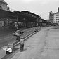 The photo shows the Bowery where it intersects with Canal Street in New York, 1947. The Third Avenue El, or, Elevated, train is on the left.