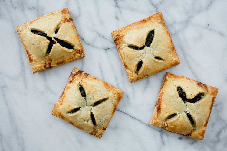 Spinach hand pies with feta and za’atar.